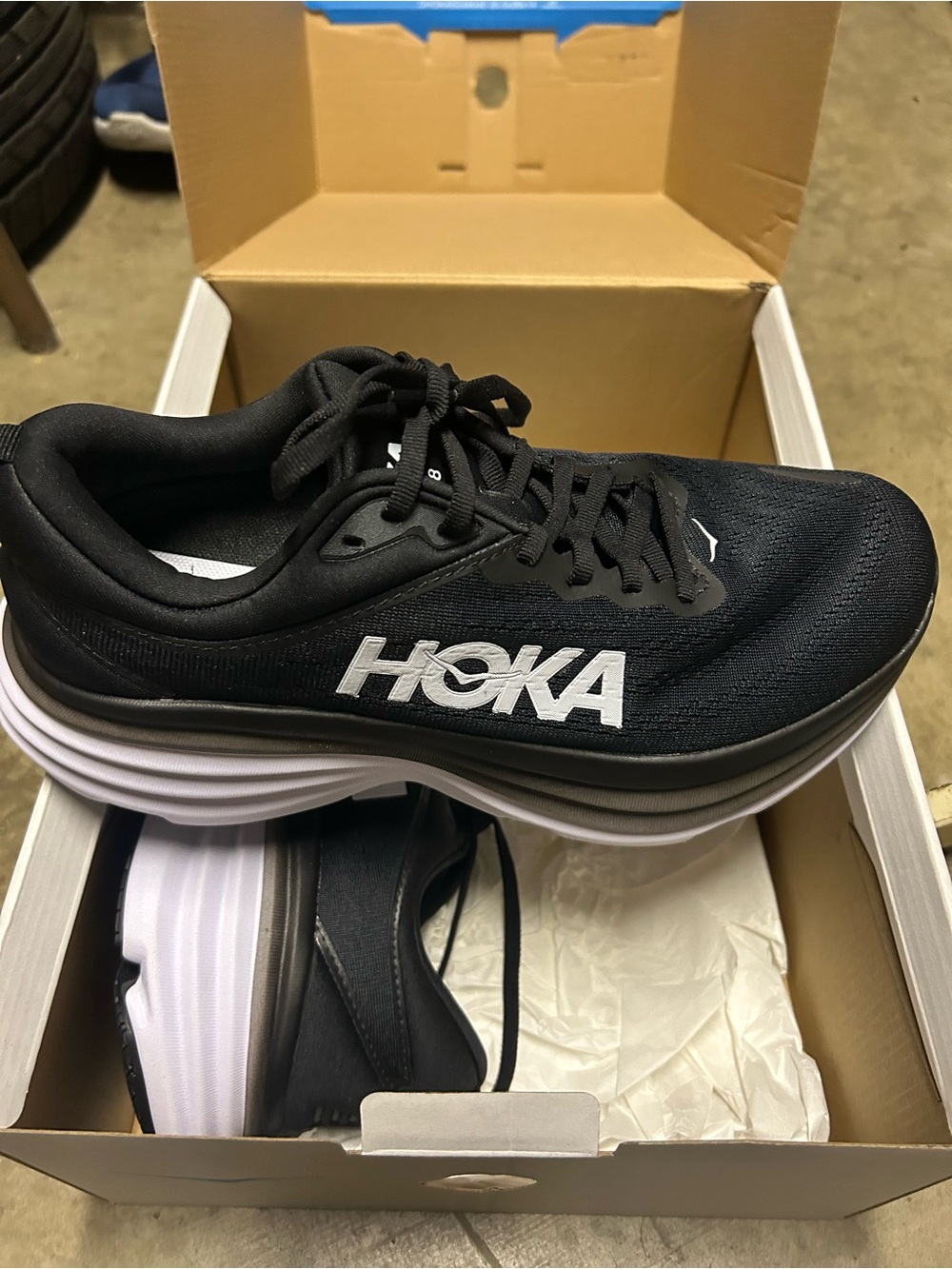 Hoka One One Black Running Shoe with Blue Logo